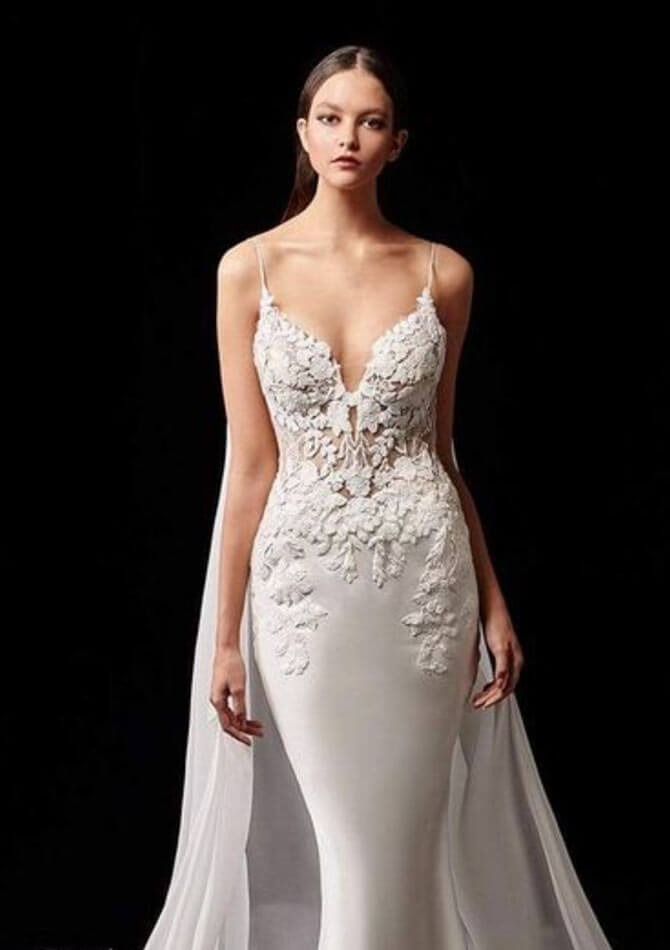 Model wearing a white gown by Enzoani
