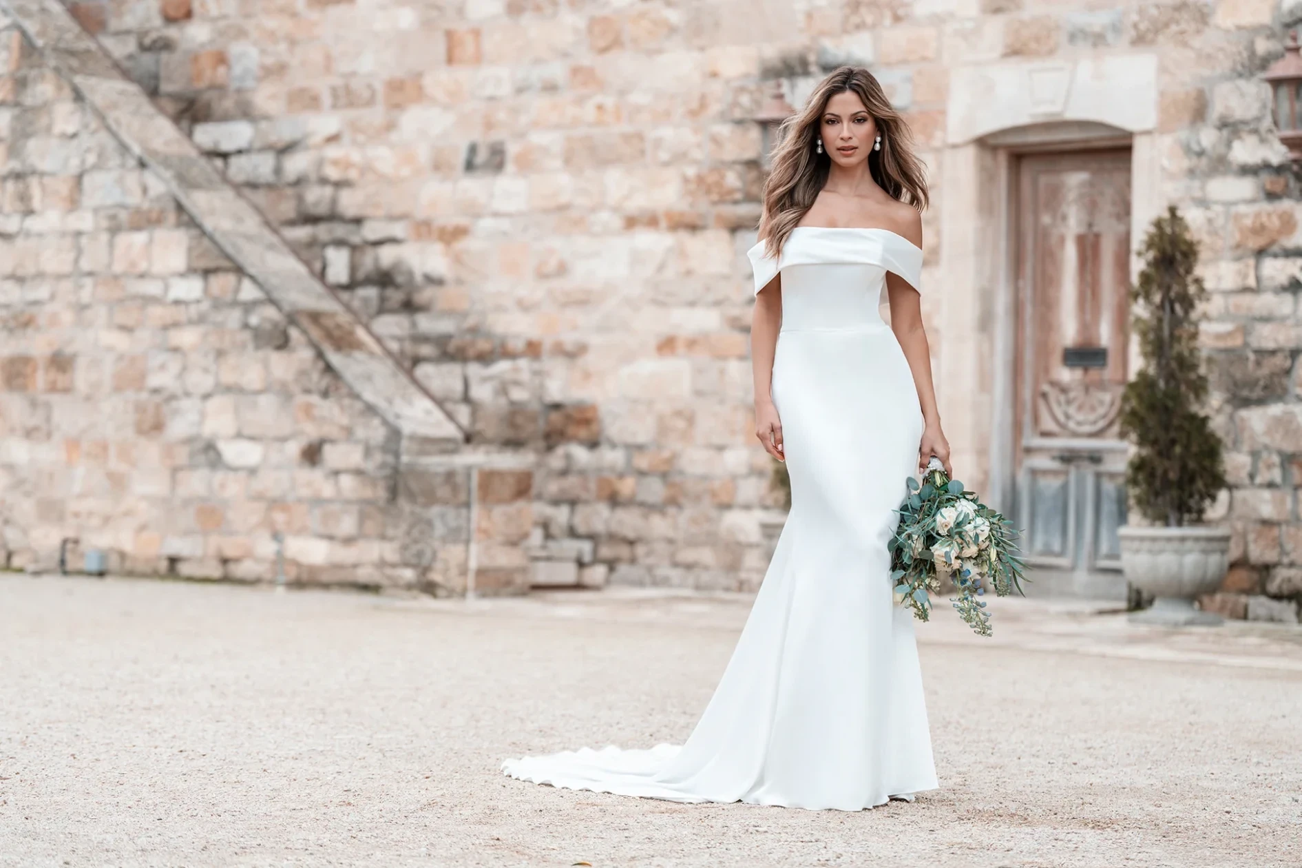 Model wearing a white gown by Wona