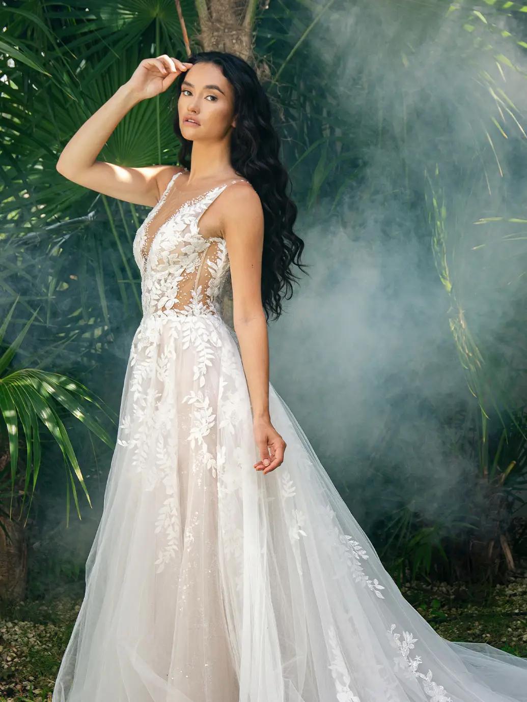 Model wearing a white gown by Enzoani